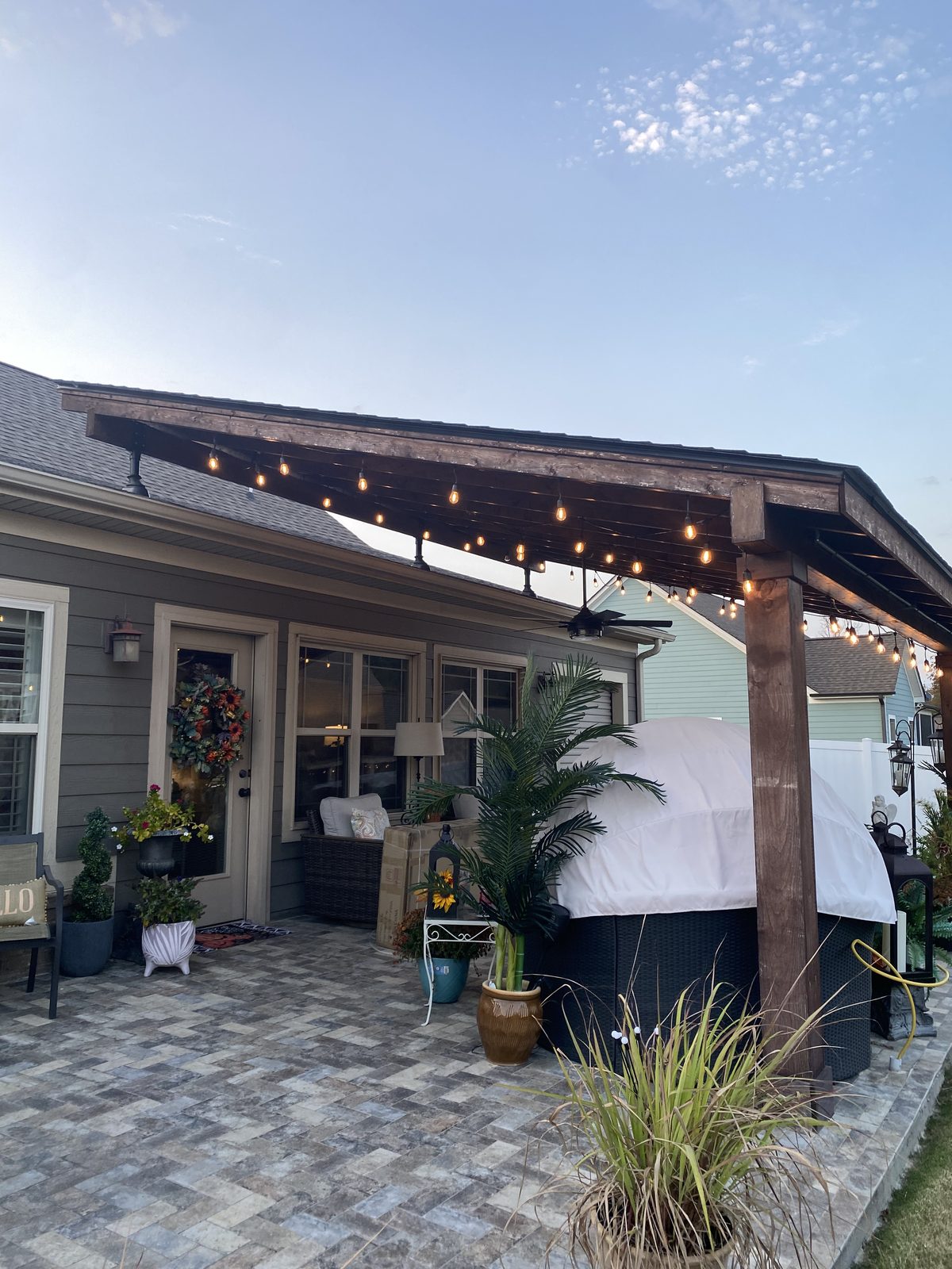 Backyard patio after Top Rock Solutions outdoor living build