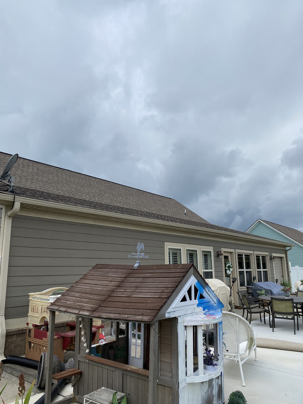 Backyard patio before Top Rock Solutions outdoor living build