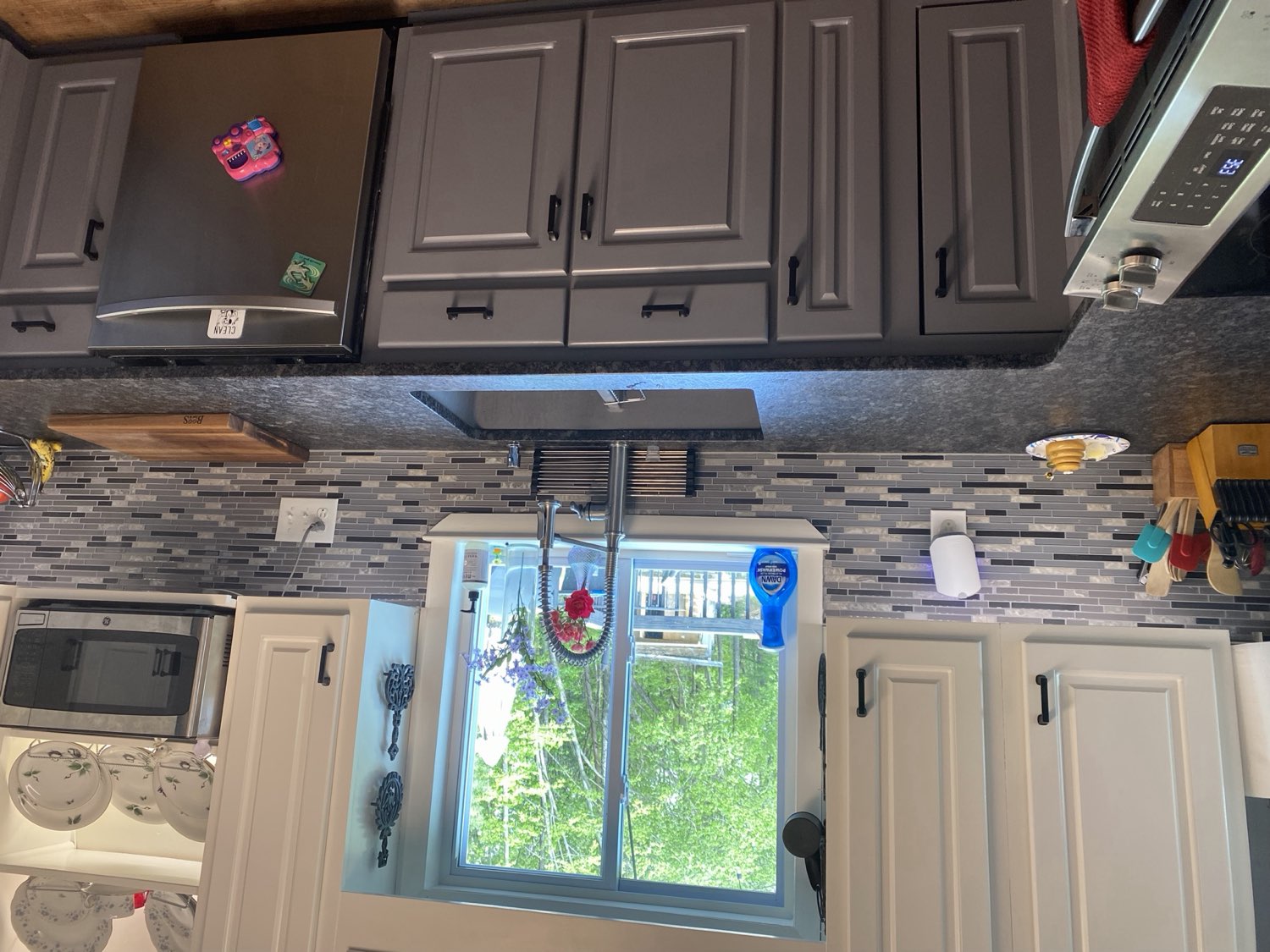 Remodeled kitchen with custom cabinetry and tile backsplash by Top Rock Solutions in Chattanooga